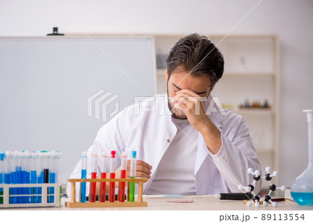 Young male chemist working at the lab Young male chemist working at the lab 89113554