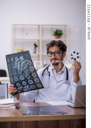Young male doctor radiologist working in the clinic Young male doctor radiologist working in the clinic 89114912