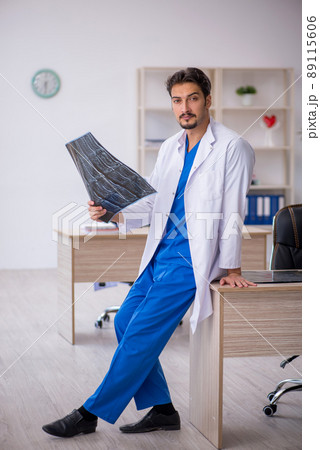 Young male doctor radiologist working in the clinic 89115606