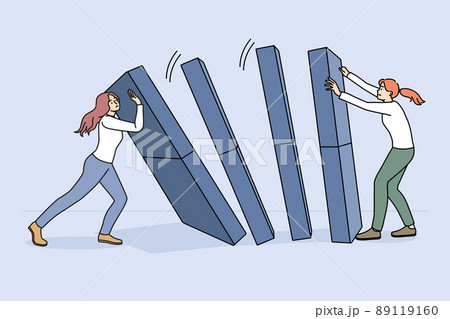 Businesswoman hold domino from falling down Businesswoman hold domino from falling down 89119160