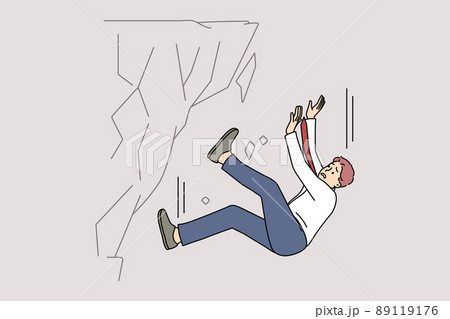 Stressed businessman fall down from rock 89119176