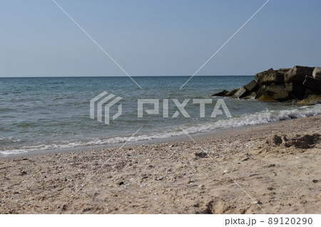 The sky was clear and the waters of the sea beat on the rocks The sky was clear and the waters of the sea beat on the rocks 89120290