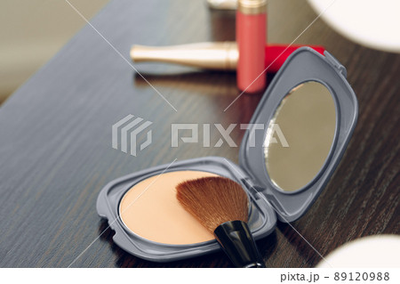Make up products on vanity table close up 89120988