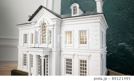 Two-story House. Miniature model home. Model of a two-story house. Two-story House. Miniature model home. Model of a two-story house. 89121495