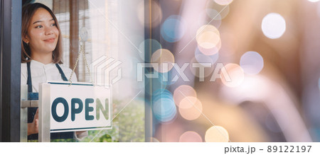 Female owner of coffee shop opening the service after lockdown quarantine 89122197