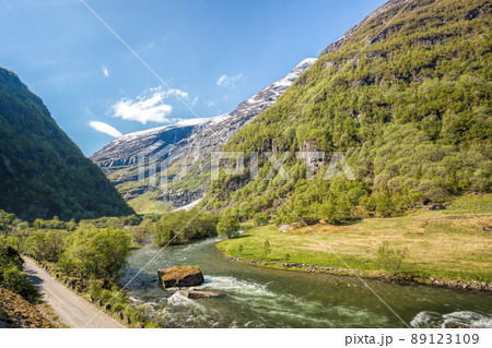 Deep valley with river of Norwegian fjords close the train journey Flamsbana between Flam and Myrdal in Aurland in Western Norway Deep valley with river of Norwegian fjords close the train journey Flamsbana between Flam and Myrdal in Aurland in Western Norway 89123109