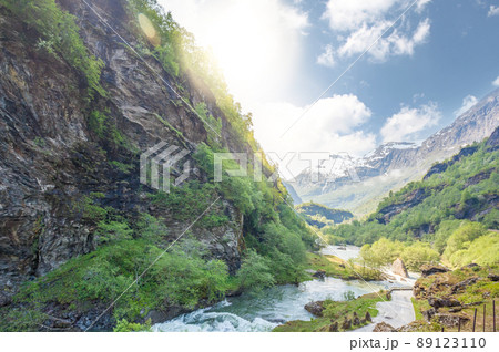 Deep valley with river of Norwegian fjords close the train journey Flamsbana between Flam and Myrdal in Aurland in Western Norway 89123110