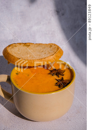 Homemade carrot ginger curcuma soup. Seasonal Pumpkin traditional soup with creamy silky texture. Healthy vegan clean eating. Seasonal spicy fall vegetables creamy pumpkin and carrot soup 89123849