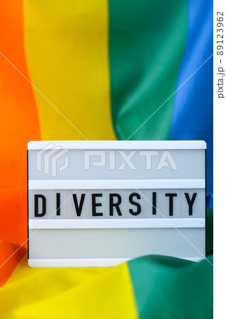 Rainbow flag with lightbox and text DIVERSITY. Rainbow lgbtq flag made from silk material. Symbol of LGBTQ pride month. Equal rights. Peace and freedom Rainbow flag with lightbox and text DIVERSITY. Rainbow lgbtq flag made from silk material. Symbol of LGBTQ pride month. Equal rights. Peace and freedom 89123962