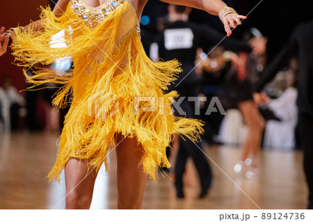 female dancer in yellow dress in dance competition 89124736