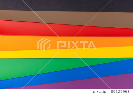 New LGBT Rainbow flag background with black and brown stripes. Group of colored cardboard. Gay pride flag 89129963