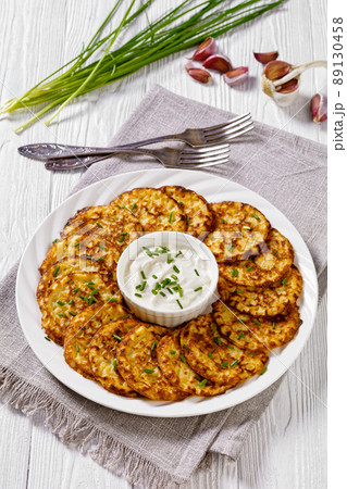 spelt flour pancakes on white plate, top view 89130458