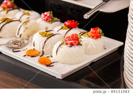 Dessert table in a Turkish hotel. Various cakes and sweets on buffet Dessert table in a Turkish hotel. Various cakes and sweets on buffet 89131083