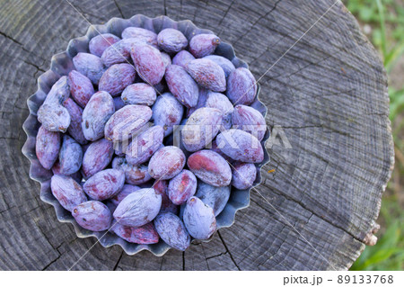 Plum, Dried plum with dew drops on a wooden background. DIY prunes Plum, Dried plum with dew drops on a wooden background. DIY prunes 89133768