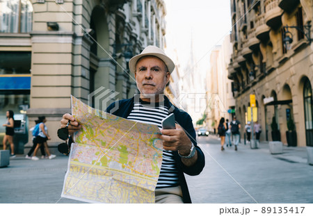 Mature male senior 60s visiting city during getaway trip 89135417