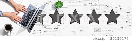 Rating star concept with person using a laptop 89136172