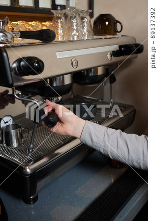espresso shot from coffee machine make by barista in coffee shop cafe. 89137392