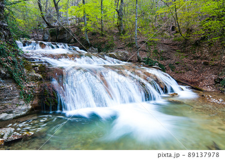 Beautiful landscape nature waterfall in the countryside in the rainforest, view of the Crimean waterfall. Pure and wonderful nature of Crimea. Ukraine, territory occupied by the Russian Federation. Beautiful landscape nature waterfall in the countryside in the rainforest, view of the Crimean waterfall. Pure and wonderful nature of Crimea. Ukraine, territory occupied by the Russian Federation. 89137978