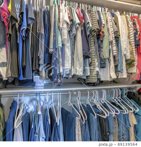 Square Walk in closet interior of a house with open shelving unit Square Walk in closet interior of a house with open shelving unit 89139564