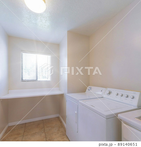 Square Sun flare Laundry room interior with vanity and stainless steel sink Square Sun flare Laundry room interior with vanity and stainless steel sink 89140651