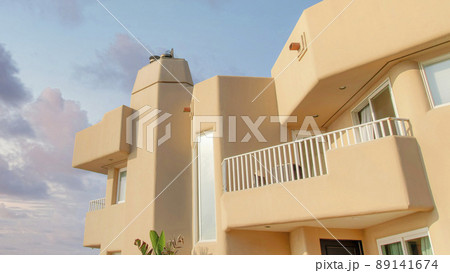 Panorama Puffy clouds at sunset Side view of a mediterranean style building at Oceanside, Califo Panorama Puffy clouds at sunset Side view of a mediterranean style building at Oceanside, Califo 89141674