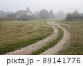 View of a deserted village street and an old wooden house 89141776