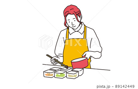 キッチンで料理をする女性	 89142449