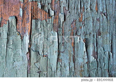 Old green wooden wall with cracked paint, background texture. High quality photo 89144468