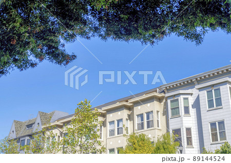 View of townhouse buildings against the clear blue sky at San Francisco, California View of townhouse buildings against the clear blue sky at San Francisco, California 89144524