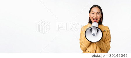 Attention announcement. Image of asian woman shouting in megaphone, recruiting, searching people, sharing information, standing over white background 89145045