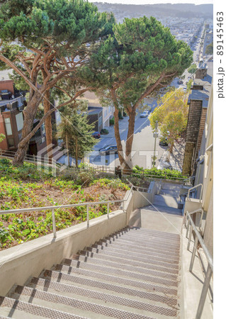 Straight concrete staircase with a view of San Francisco neighborhood in California 89145463