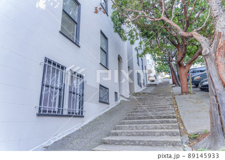 Concrete steps on a sloped side walk near the buildings in San Francisco, California 89145933