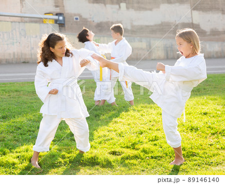 Kids sparring during karate training Kids sparring during karate training 89146140