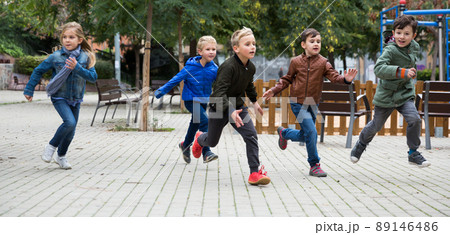 Children running on playground 89146486