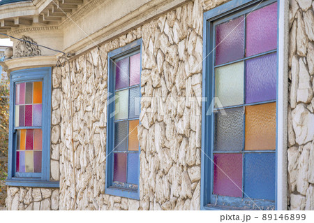 Building exterior with gray framed windows with colorful glass panes at San Francisco, California Building exterior with gray framed windows with colorful glass panes at San Francisco, California 89146899