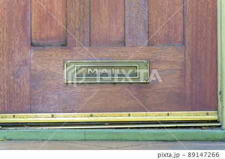 Letterbox on a wooden door at San Francisco, California 89147266