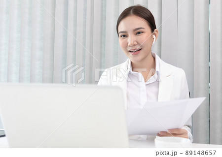 Businesswoman using laptop to work, Asian woman working in the office, World of technology and internet communication, Using computers to conduct financial transactions because the convenience. Businesswoman using laptop to work, Asian woman working in the office, World of technology and internet communication, Using computers to conduct financial transactions because the convenience. 89148657