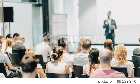 Business speaker giving a talk at business conference event. 89153840