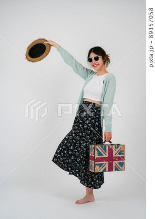 Portrait asian woman tourist with travel suitcase with sunglasses, isolated on white background - summer travel concept. 89157058