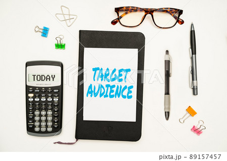 Text showing inspiration Target Audience. Business approach category of showing you want to address your words to Office Supplies Over Desk With Keyboard And Glasses And Coffee Cup For Working Text showing inspiration Target Audience. Business approach category of showing you want to address your words to Office Supplies Over Desk With Keyboard And Glasses And Coffee Cup For Working 89157457