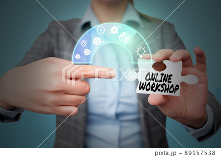Text showing inspiration Online Workshop. Business idea shows of goods and commodities over the electronic websites Lady in suit pointing puzzle piece representing innovative thinking. Text showing inspiration Online Workshop. Business idea shows of goods and commodities over the electronic websites Lady in suit pointing puzzle piece representing innovative thinking. 89157538