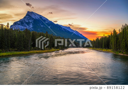 Sunrise above Bow River and Mount Rundle from Banff Pedestrian Bridge in Canada 89158122