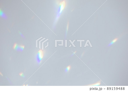 Blurred rainbow light refraction texture on white wall 89159488