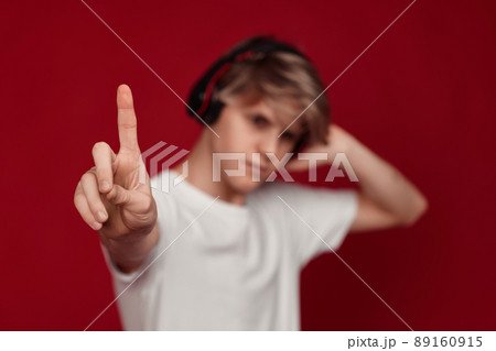 man with headphones pressing button on virtual screens man with headphones pressing button on virtual screens 89160915
