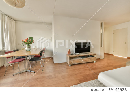 Dining area with flowers on the table in a modern house 89162928