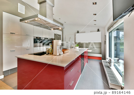 The interior of an open rich kitchen fully equipped with modern appliances The interior of an open rich kitchen fully equipped with modern appliances 89164146