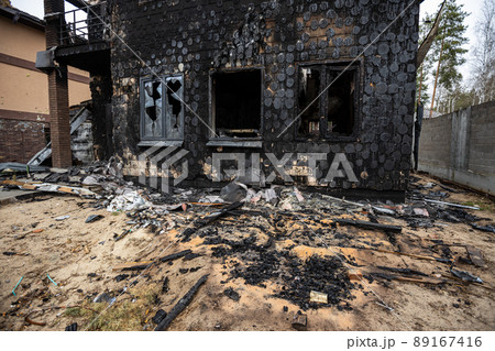 Hostomel, Kyev region  Ukraine - 09.04.2022: Cities of Ukraine after the Russian occupation. Houses that burned down after being hit by rockets, mines. Irpin, Bucha, Gostomel. 89167416