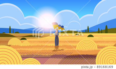 woman holding Ukrainian flag pray for Ukraine peace save Ukraine from russia stop war concept 89168169