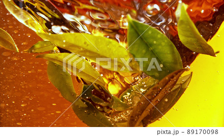 Detail of rotating tea leaves in water twister. Detail of rotating tea leaves in water twister. 89170098