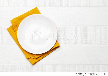 Empty plate over towel 89170881